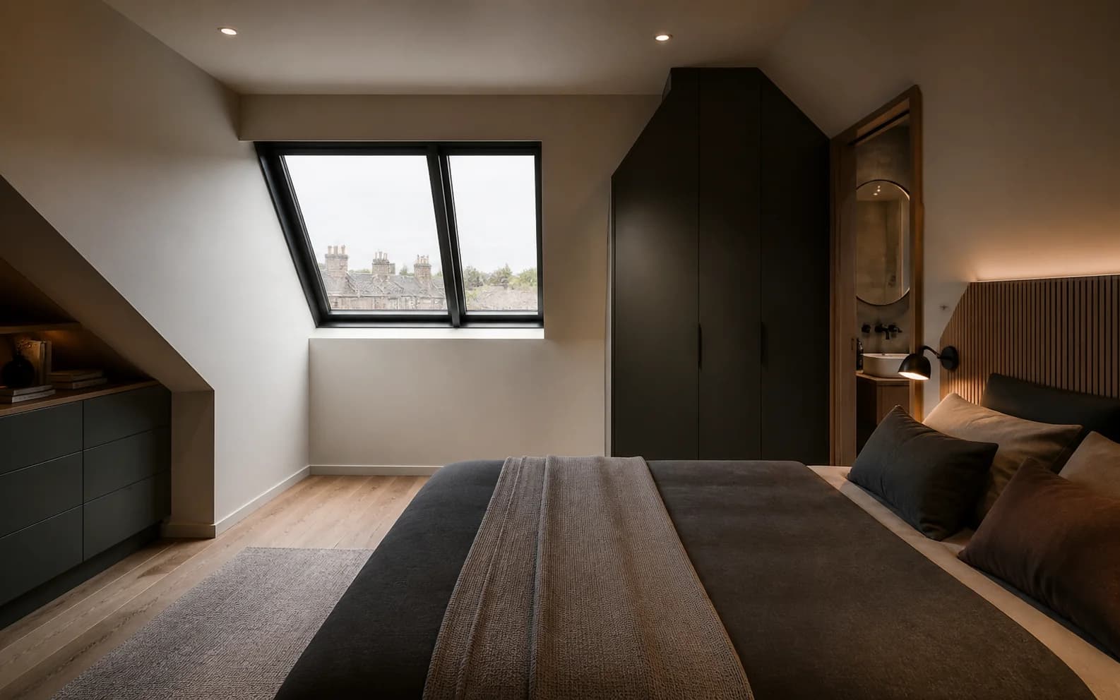 Illustrative completed loft bedroom with roof windows and bespoke storage