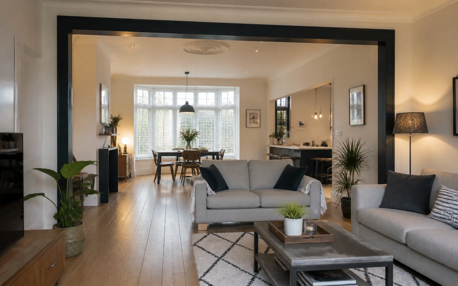 Illustrative open-plan reception room after a structural wall alteration